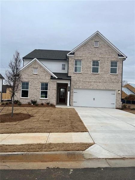 Front exterior of a new home in Riverside Ridge, Lawrenceville, GA, highlighting curb appeal (Image 21).