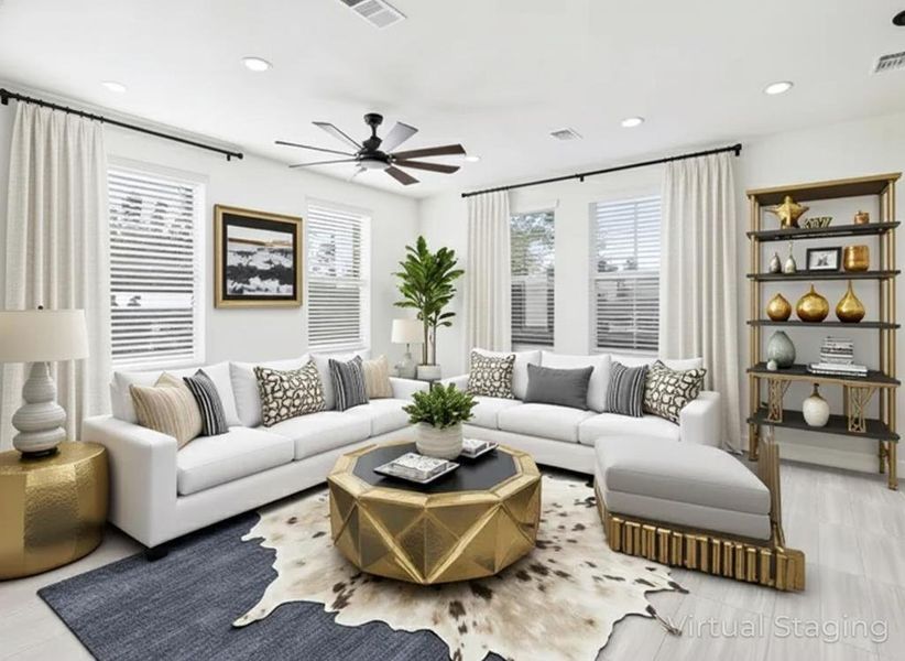 Living area with recessed lighting and a ceiling fan Living area with recessed lighting and a ceiling fan