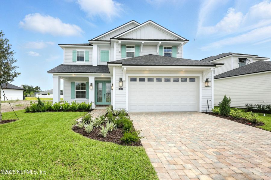 Front exterior of a new home in Silver Landing At Silverleaf, St. Augustine, FL, highlighting curb appeal (Image 23).