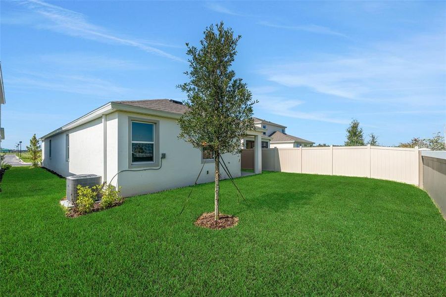 Exterior details and patio area of a home in Seaire, Parrish (Image 25).