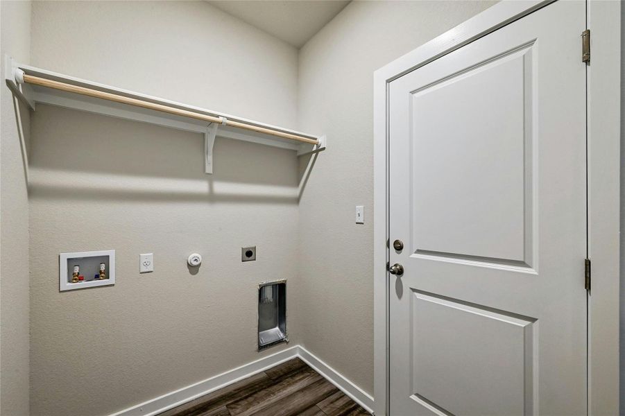 laundry room with access to the attached garage