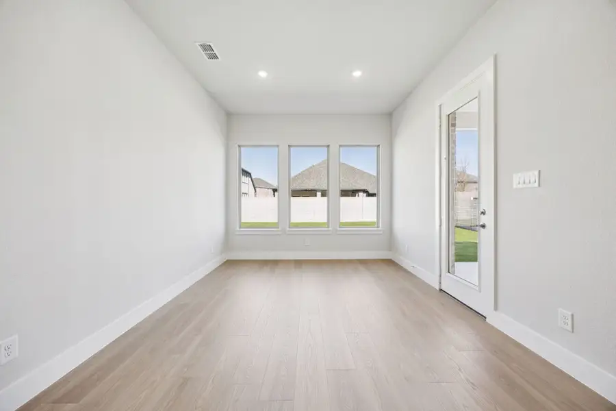 Representative unfurnished interior of a home built from the Kenai by Centre Living Homes in Painted Tree Lakeside, McKinney (Image 22).
