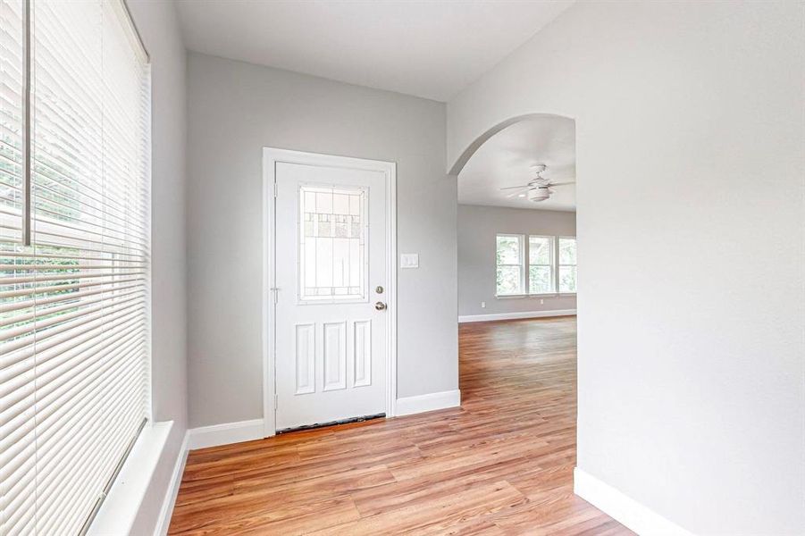 Entrance foyer featuring light hardwood / wood-style flooring and ceiling fan