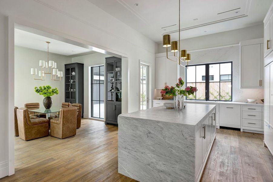 Kitchen door access the driveway area and covered walkway to the garage.