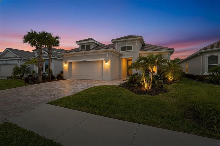 Front exterior of a new home in Esplanade at Artisan Lakes, Palmetto, FL, highlighting curb appeal (Image 20).