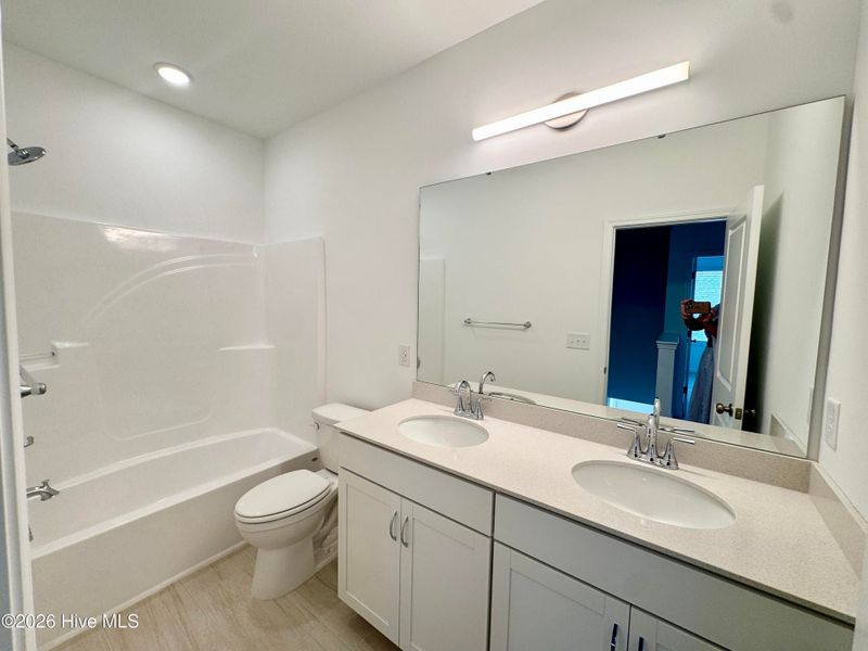 Furnished interior view inside a new home in Coastal Haven, Leland (Image 17).