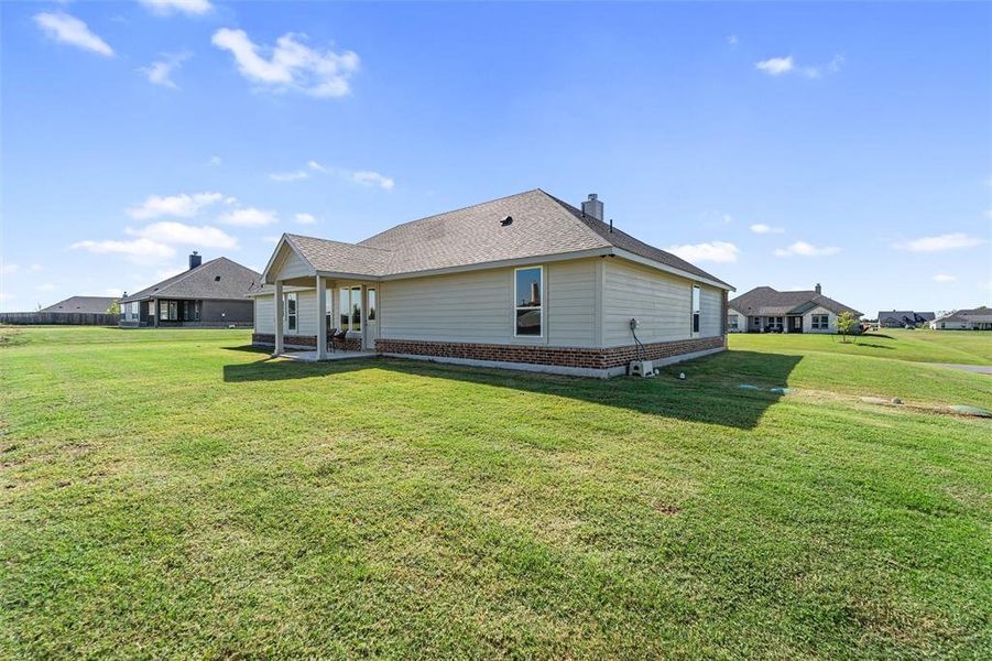 Exterior details and patio area of a home in Nash Estates, Tom Bean (Image 23).