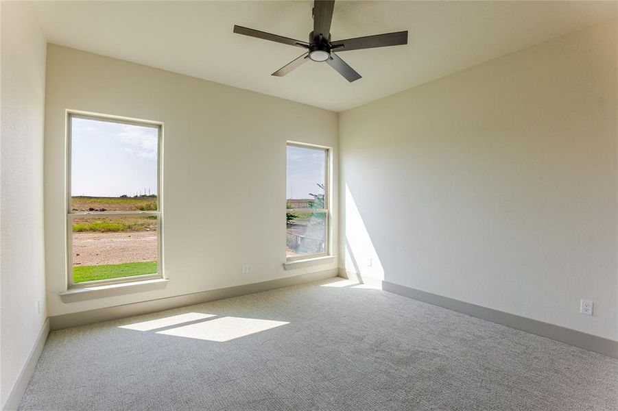 Secondary bedroom overlooking the back yard. Secondary bedroom overlooking the back yard.