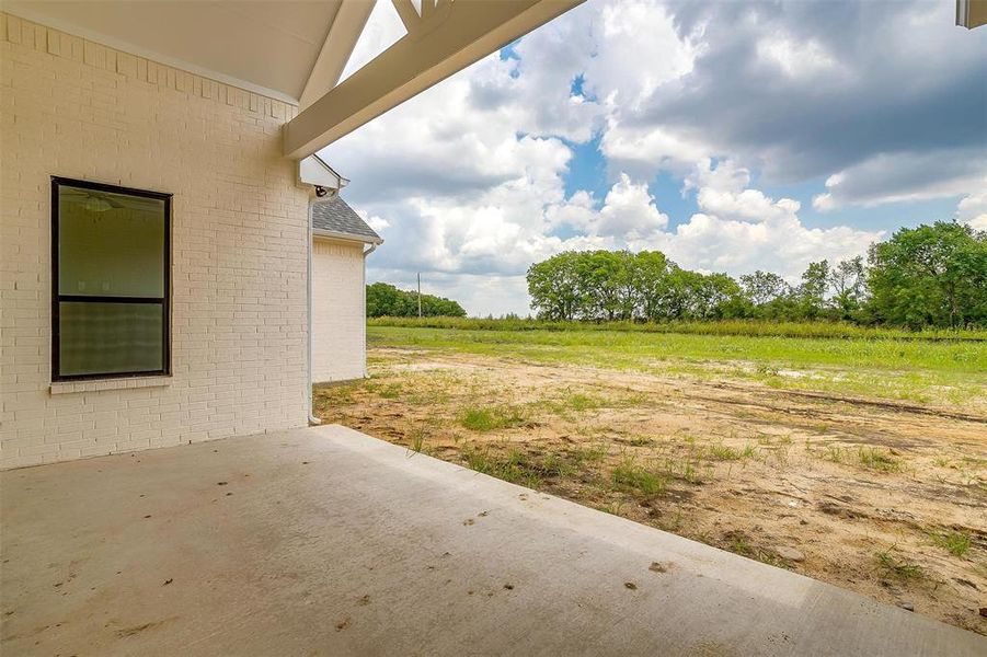 View of yard featuring a patio and a rural view