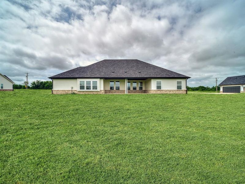 Front exterior of a new home in , Celeste, TX, highlighting curb appeal (Image 18).
