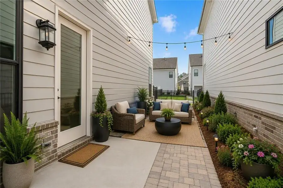 Exterior details and patio area of a home in Waterhaven, Cumming (Image 19).