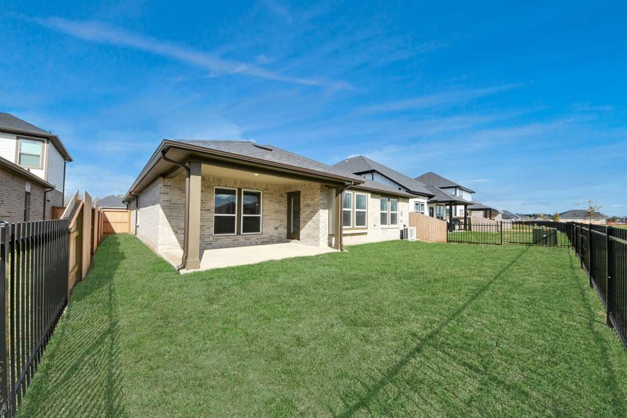 Exterior details and patio area of a home in Laurel Landing: Landmark Collection, Alvin (Image 24). Exterior details and patio area of a home in Laurel Landing: Landmark Collection, Alvin (Image 24).