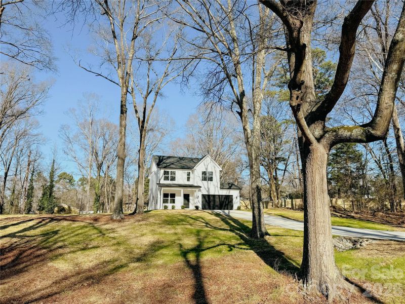 Front exterior of a new home in , Huntersville, NC, highlighting curb appeal (Image 22).