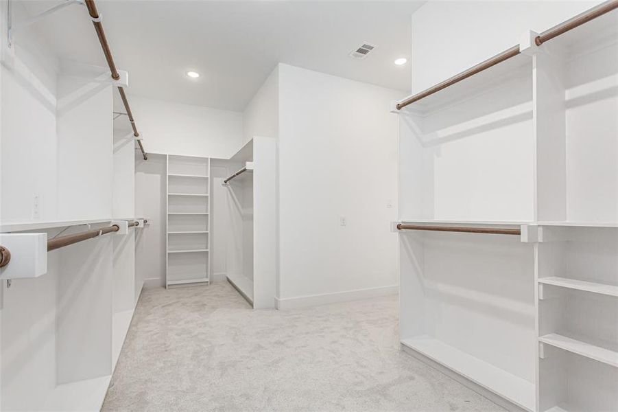 Walk in closet featuring carpet flooring