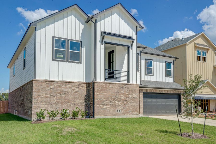 Front exterior of a new home in Townsen Landing, Humble, TX, highlighting curb appeal (Image 22).