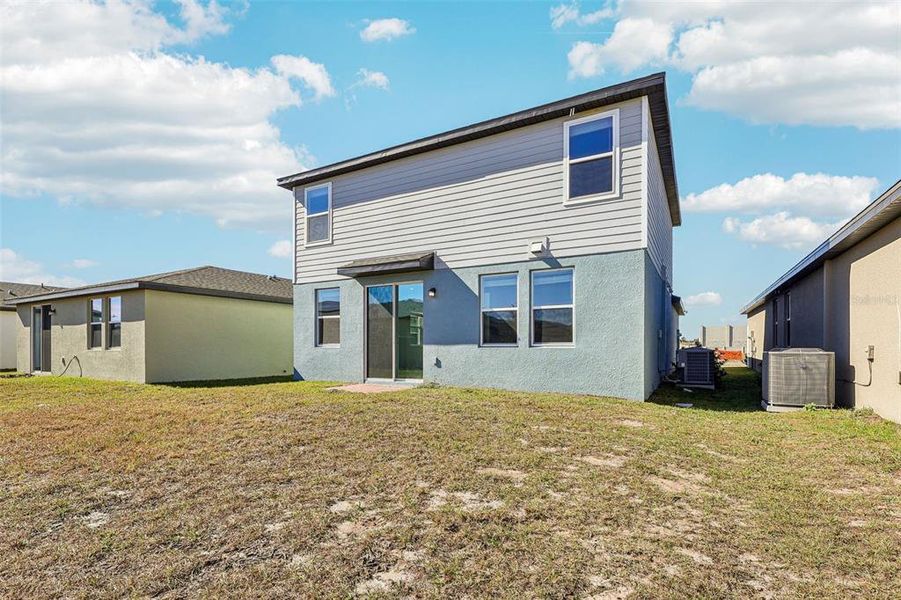 Exterior details and patio area of a home in Lake Deer Estates - Classic Series, Poinciana (Image 3).