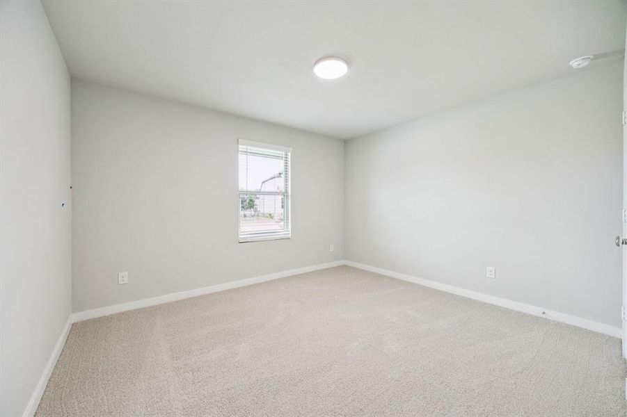 Bedroom in the Hayden home plan by Trophy Signature Homes – REPRESENTATIVE PHOTO Bedroom in the Hayden home plan by Trophy Signature Homes – REPRESENTATIVE PHOTO