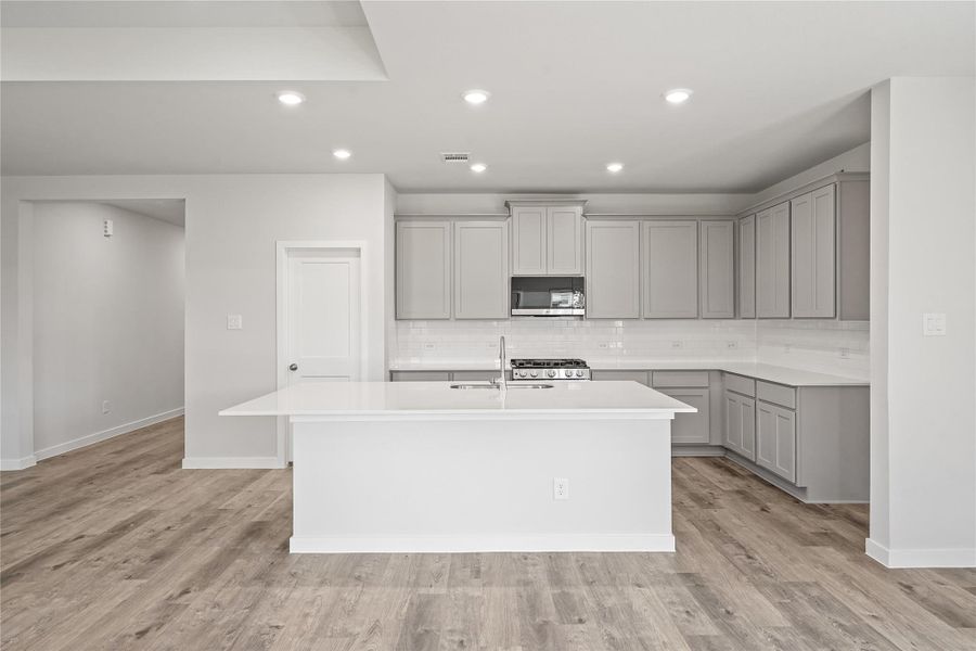 Furnished interior view inside a new home in Sunterra, Katy (Image 6).