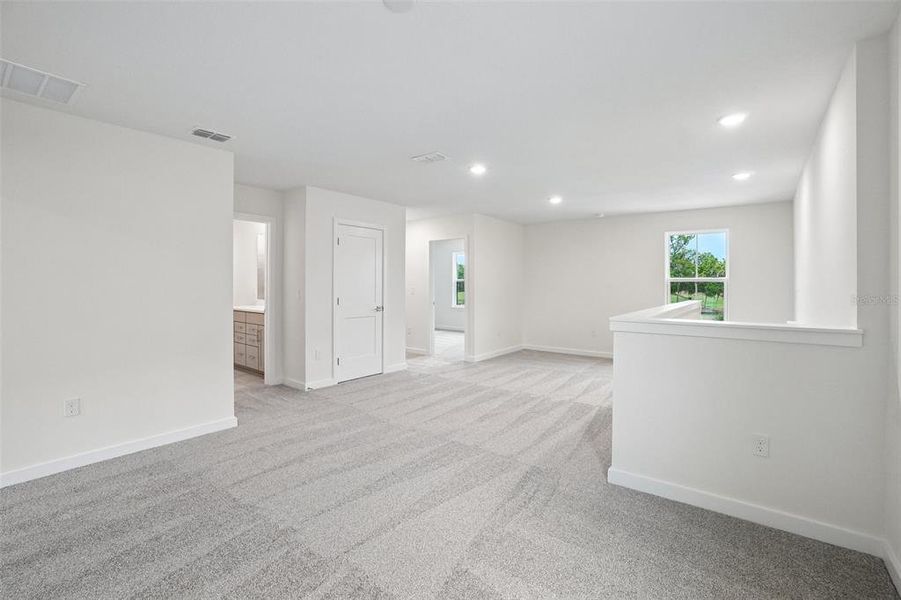 Spacious, unfurnished interior of a new home in Grasslands West, Lakeland (Image 44).