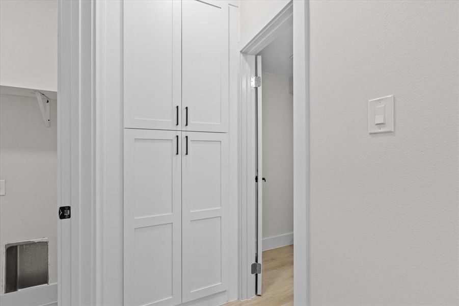 Hall with light wood-style floors