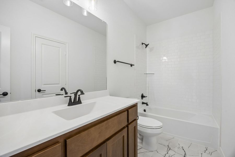 Furnished interior view inside a new home in Country Lakes, Denton (Image 17).
