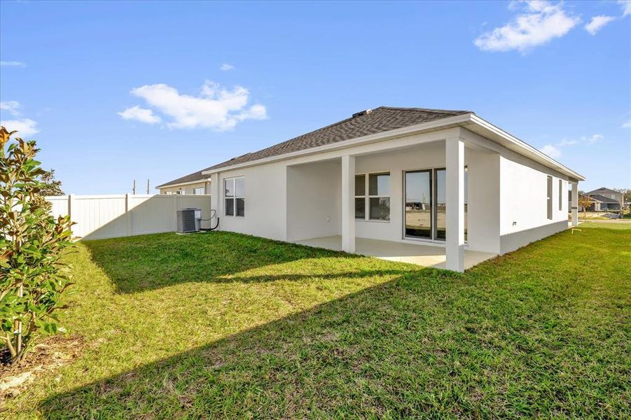 Exterior details and patio area of a home in Robins Run, Lake Wales (Image 3).