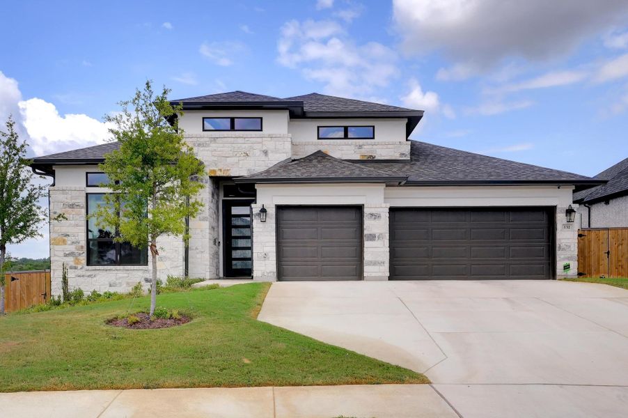 Front exterior of a new home in La Cima 60', San Marcos, TX, highlighting curb appeal (Image 1). Front exterior of a new home in La Cima 60', San Marcos, TX, highlighting curb appeal (Image 1).