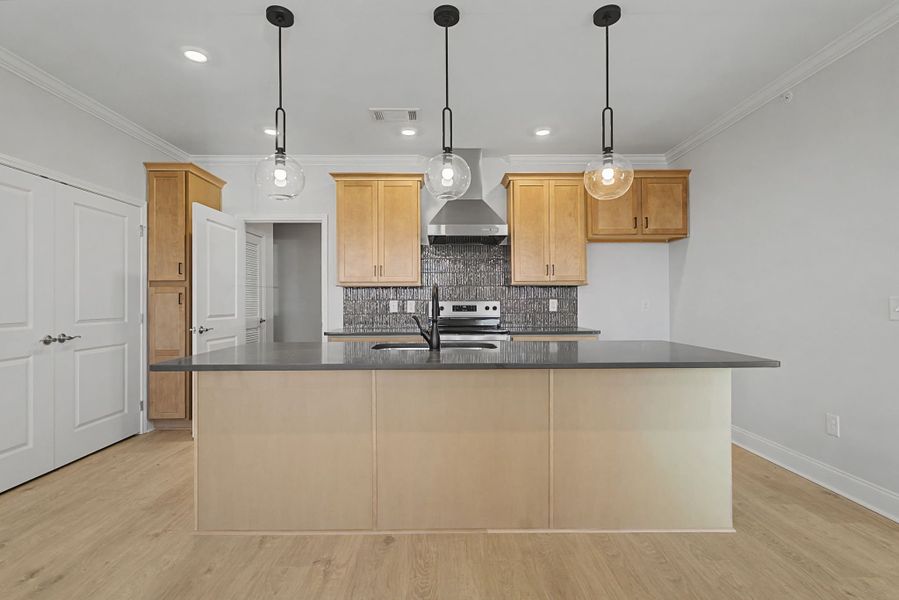 Carothers Farms Town Center Homes (Condos) Kitchen with Island and Accent Lighting