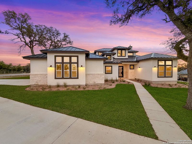Front exterior of a new home in , Bulverde, TX, highlighting curb appeal (Image 26).