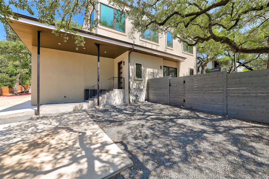 Rear view of property with stucco siding and a patio area