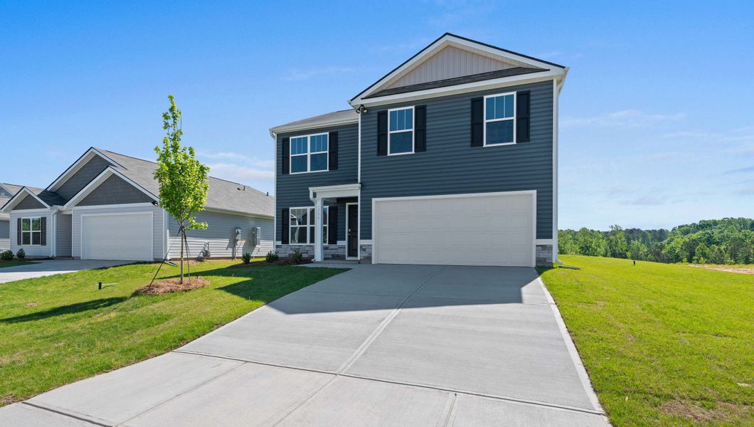Front exterior of a new home in Wildbrook Village, Waynesville, NC, highlighting curb appeal (Image 1). Front exterior of a new home in Wildbrook Village, Waynesville, NC, highlighting curb appeal (Image 1).