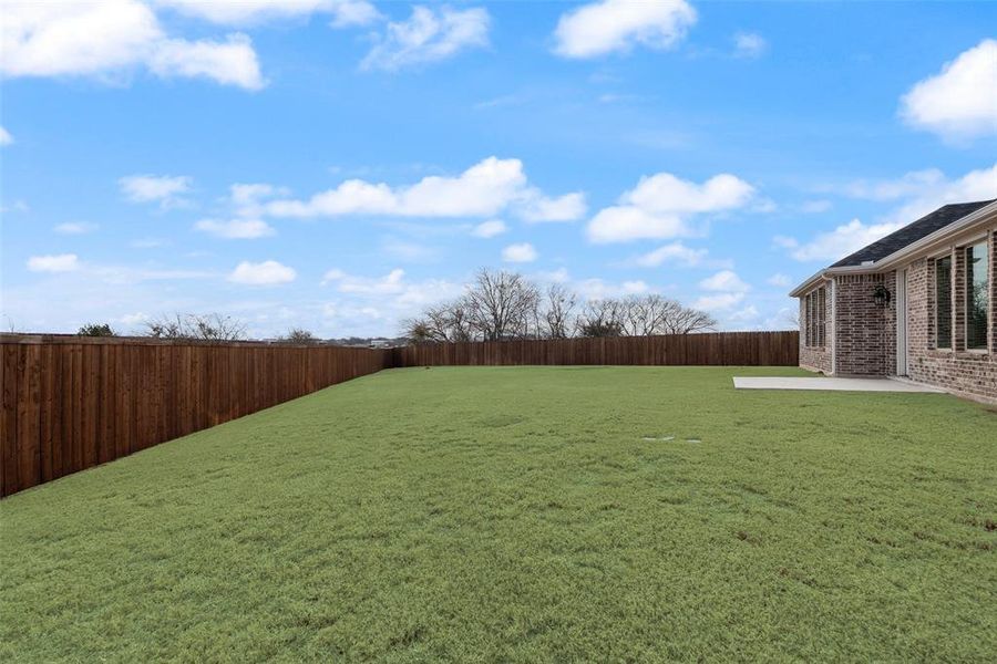 Exterior details and patio area of a home in Walden Pond, Forney (Image 22).