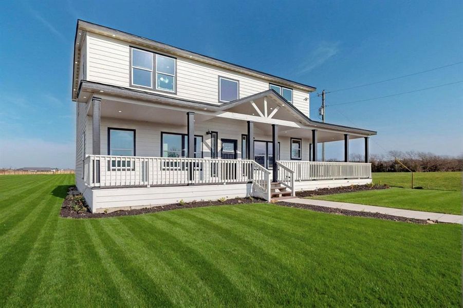 Front exterior of a new home in , Abbott, TX, highlighting curb appeal (Image 27). Front exterior of a new home in , Abbott, TX, highlighting curb appeal (Image 27).