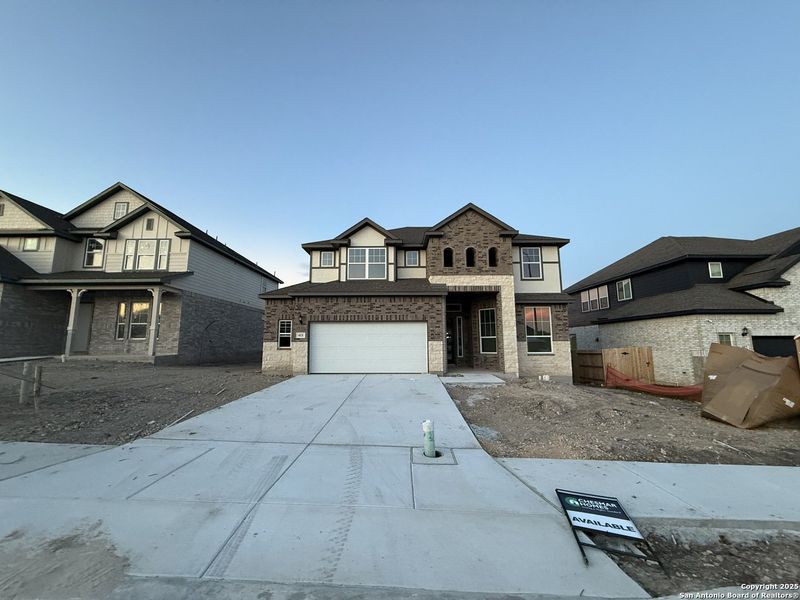 Front exterior of a new home in Buffalo Crossing – New Phase Now Preselling, Cibolo, TX, highlighting curb appeal (Image 1).