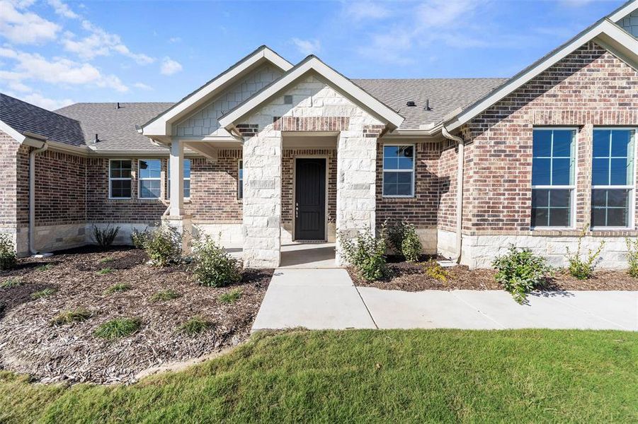 Front exterior of a new home in Clear Sky Addition, Valley View, TX, highlighting curb appeal (Image 27). Front exterior of a new home in Clear Sky Addition, Valley View, TX, highlighting curb appeal (Image 27).