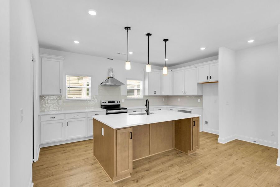Representative furnished interior of a home built from the Titusville II by Regent Homes in Marlon's Creek, Spring Hill (Image 6).