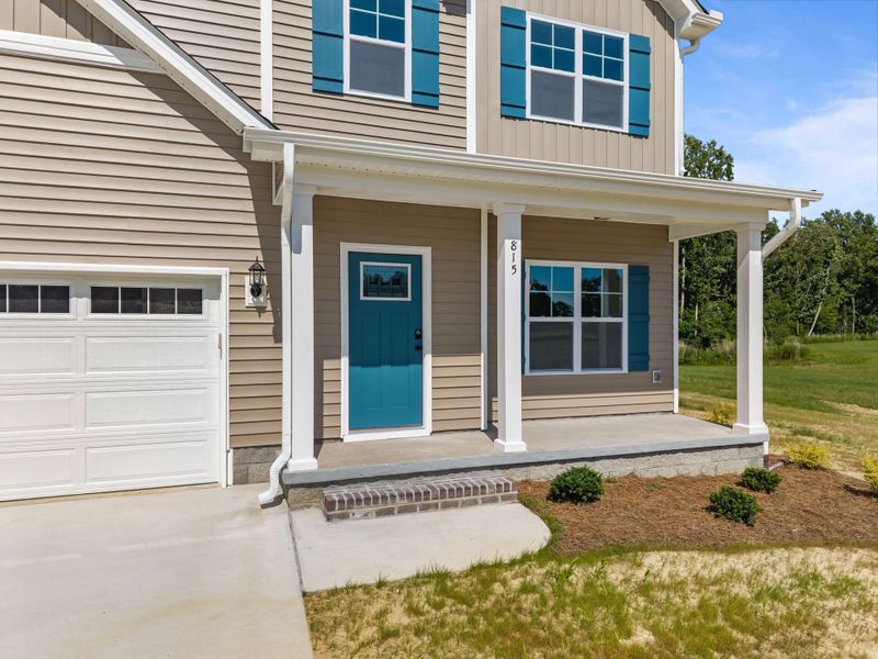 Front exterior of a new home in Laurel Oaks, Greenville, NC, highlighting curb appeal (Image 24). Front exterior of a new home in Laurel Oaks, Greenville, NC, highlighting curb appeal (Image 24).