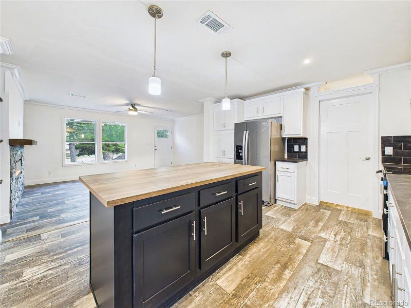 Large island provides plenty of prep space and casual dining options.