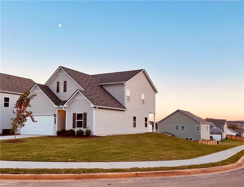 Front exterior of a new home in Duncan Farm, Cartersville, GA, highlighting curb appeal (Image 1).