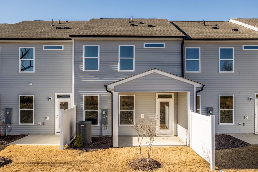 Exterior details and patio area of a home in 1158 Place Townhomes, Wilson (Image 3).