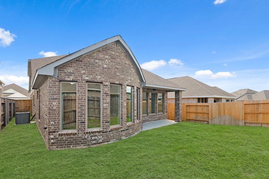Exterior details and patio area of a home in The Trails, New Caney (Image 20).