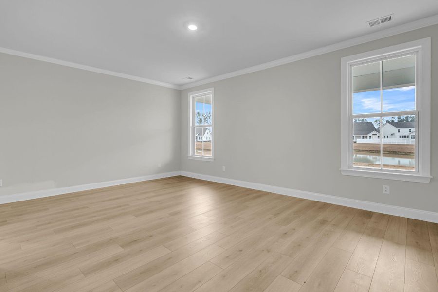 Spacious, unfurnished interior of a new home in Tidewater at Lakes of Cane Bay, Summerville (Image 23).