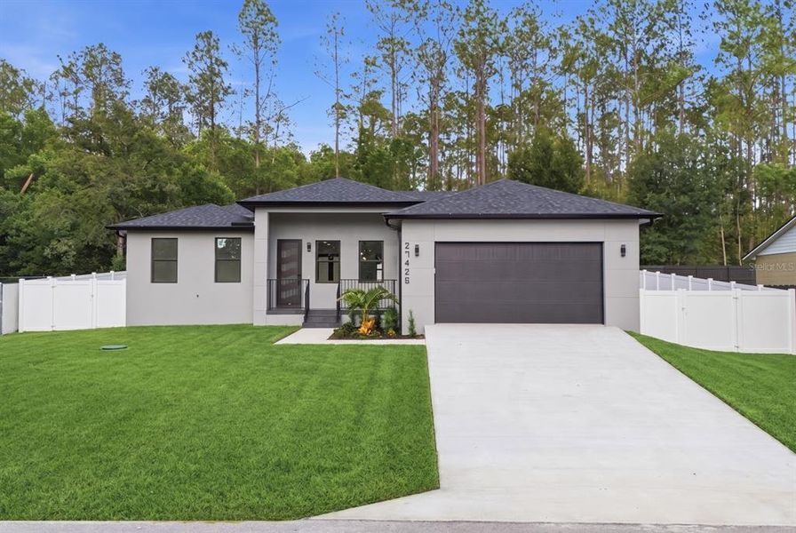 Front exterior of a new home in , Brooksville, FL, highlighting curb appeal (Image 2). Front exterior of a new home in , Brooksville, FL, highlighting curb appeal (Image 2).
