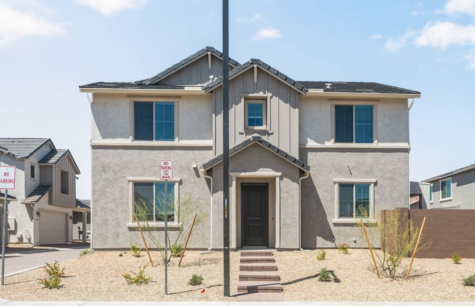 Front exterior of a new home in Asante- Atrium Series, Surprise, AZ, highlighting curb appeal (Image 2).
