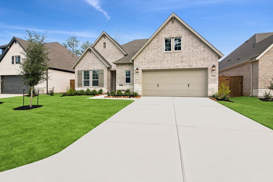 Front exterior of a new home in The Highlands 55' - Encore Collection, Porter, TX, highlighting curb appeal (Image 1).