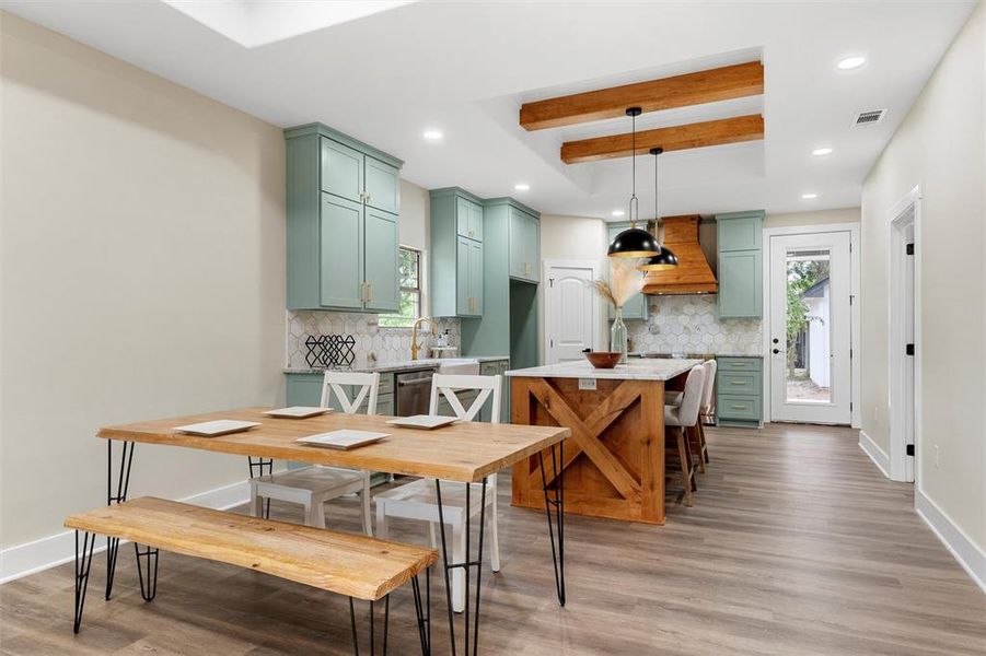 Dining space featuring light wood-type flooring, baseboards, recessed lighting, and healthy amount of natural light