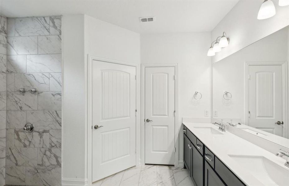 Owner's private bath with oversized shower*real home pictured