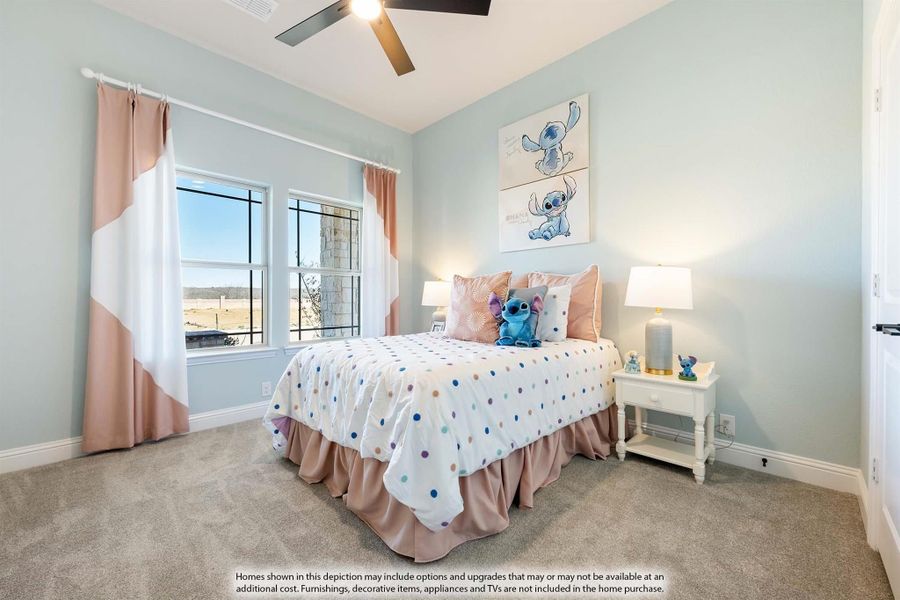 Children's bedroom with light blue walls, carpet flooring, ceiling fan, and a bed with polka dot bedding near a window. Children's bedroom with light blue walls, carpet flooring, ceiling fan, and a bed with polka dot bedding near a window.