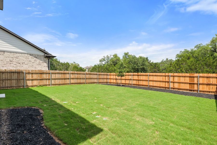 Exterior details and patio area of a home in Heritage, Dripping Springs (Image 33).