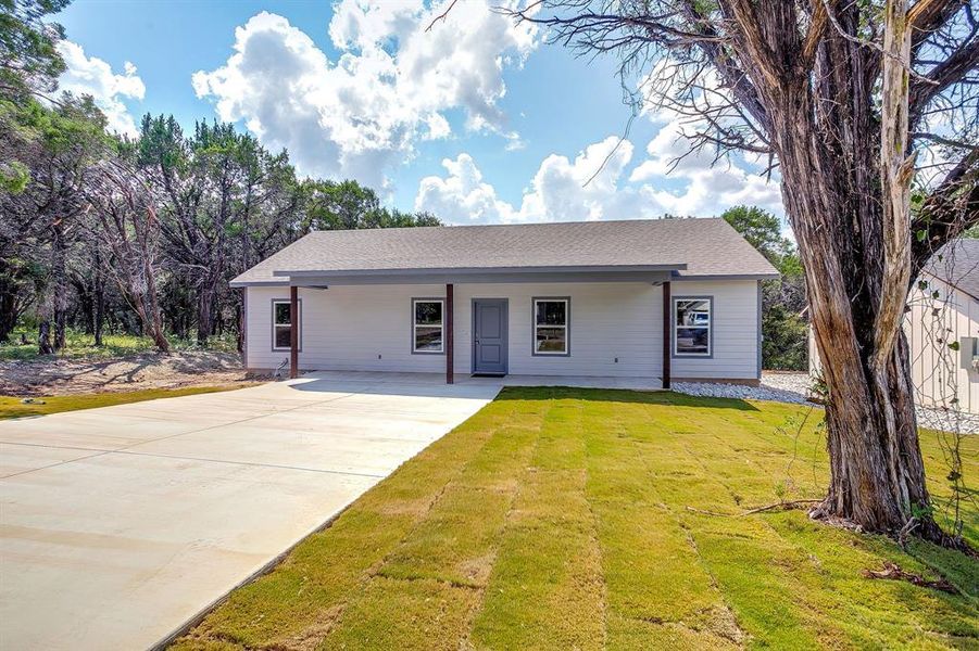 Front exterior of a new home in , Rio Vista, TX, highlighting curb appeal (Image 1).